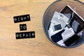 Broken smart phone and smashed tablets in rubbish bin with warranties and guarantee, right to repair concept, warranties