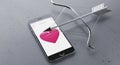 Broken Smartphone with Heart on Screen Royalty Free Stock Photo
