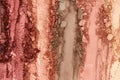 Broken and smashed make-up eyeshadow pallete, lay of brush strokes, close-up for background, top view Royalty Free Stock Photo