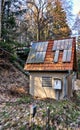 Broken solar panels on the roof of an old railway house. Dynamism through motion blur Royalty Free Stock Photo