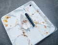 Broken Spatula on Empty Plastic Cake Tray - Afterparty Mystery Royalty Free Stock Photo