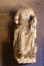 Broken statue of woman who cut off her husbands head in Greek mythology