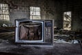 Broken television in an abandoned building