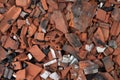 Broken terracotta tiles from burnt roof. Smashed roof tiles, clay red tiles. Roof destrucion.