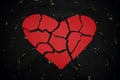Broken and torn red heart paper cutout in black background. Royalty Free Stock Photo