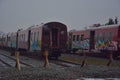 Broken train compartments with graffiti
