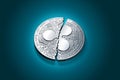 Broken into two pieces silver Ripple coin XRP Royalty Free Stock Photo