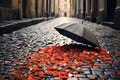 broken umbrella parts scattered on a cobblestone street Royalty Free Stock Photo