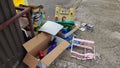 Broken or unwanted childrens` toys left out by recycling bin for disposal