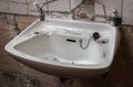 Broken and Vandalized Industrial Bathroom Sink