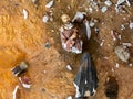 Broken vandalized plaster catholic plaster statues in the ground Royalty Free Stock Photo