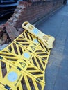 Broken Wall in A Carpark Been Hit by a Car With Warning Barrier Around the Fallen Bricks Royalty Free Stock Photo