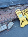 Broken Wall in A Carpark Been Hit by a Car With Warning Barrier Around the Fallen Bricks Royalty Free Stock Photo