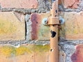 Broken water pipe on a brick wall Royalty Free Stock Photo