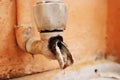 Broken Water Tap with Water Drops Royalty Free Stock Photo