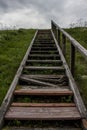 Broken weathered wooden stairs on the hill Royalty Free Stock Photo