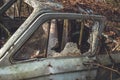 Broken window in an abandoned car/broken glass in an abandoned car Royalty Free Stock Photo