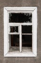 Broken window of an abandoned house Royalty Free Stock Photo