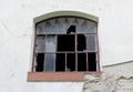 Broken window with a brown frame Royalty Free Stock Photo