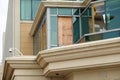 Broken window covered by a sheet of plywood after a hurricane broke the glass Royalty Free Stock Photo