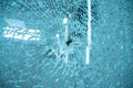 Broken window glass with blue background Royalty Free Stock Photo