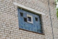 a broken window made of glass blocks in a brick wall Royalty Free Stock Photo