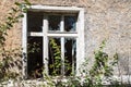 Broken window in an old abandoned house