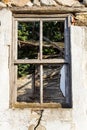 Broken window on old abandoned house. Ruin. Close up Royalty Free Stock Photo