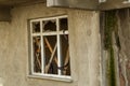 Broken window of an unfinished house Royalty Free Stock Photo