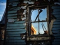 A broken window in the wall of a dilapidated and abandoned house. Royalty Free Stock Photo