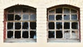 Broken windows of an abandoned, old factory from the time of the founding Royalty Free Stock Photo