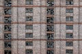 Broken windows on abandoned redbrick building