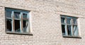 Broken windows in a brick building Royalty Free Stock Photo