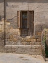 Broken windows and grunge stone bricks wall, Cairo, Egypt Royalty Free Stock Photo