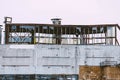 Broken windows in an old building of abandoned factory