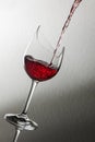 Broken wine glass with red wine pour right Royalty Free Stock Photo