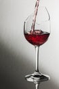 Broken wine glass with red wine pour Royalty Free Stock Photo