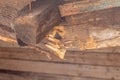 Broken wooden beam of the canopy. wooden roof of a barn destroyed due to the weather