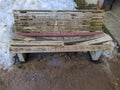 broken wooden bench in early spring. Royalty Free Stock Photo