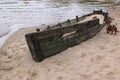 Broken wooden boat on the shore of the lake. Kaunas, Lithuania Royalty Free Stock Photo