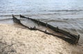 Broken wooden boat on the shore of the lake. Kaunas, Lithuania Royalty Free Stock Photo