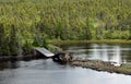 Broken wooden bridge over a pond Royalty Free Stock Photo