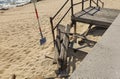 Broken wooden steps leading down to sandy beach in Vila do Conde, Portugal. Royalty Free Stock Photo