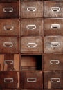 Broken wooden vintage cabinet with missing drawers. Library card or file catalog. Royalty Free Stock Photo