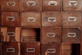 Broken wooden vintage cabinet with missing drawers. Library card or file catalog. Royalty Free Stock Photo