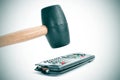 Broking a remote control with a hammer