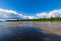 Cloud Formation Background With Boat Sailing Along The Suriname River On A Sunny Day. Royalty Free Stock Photo