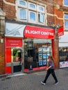 Flight Centre shop in Bromley High Street with a blurred pedestrian walking past