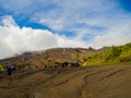 BROMO, INDONESIA - JULY 12, 2O17 : Tourists hiking up to the top of Mount Bromo, the active mount Bromo is one of the