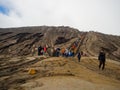 BROMO, INDONESIA - JULY 12, 2O17 : Tourists hiking up to the top of Mount Bromo, the active mount Bromo is one of the